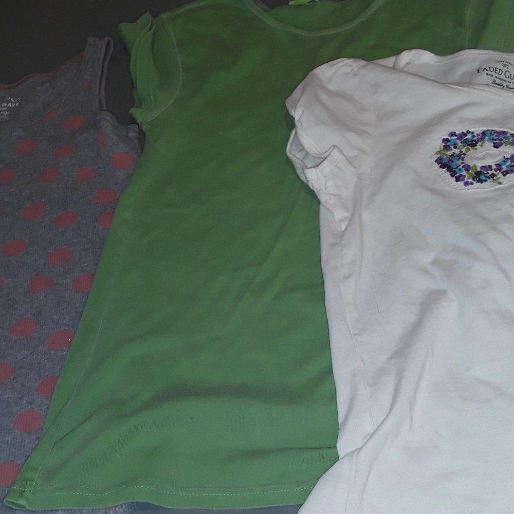 Gray tank top, green T-shirt, white T-shirt
